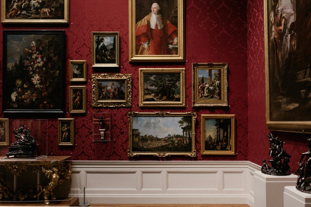 Old fashioned pictures hung on a museum wall