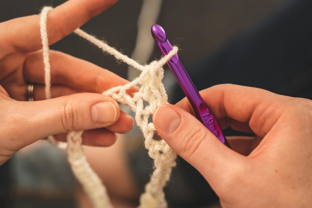 A lady crocheting